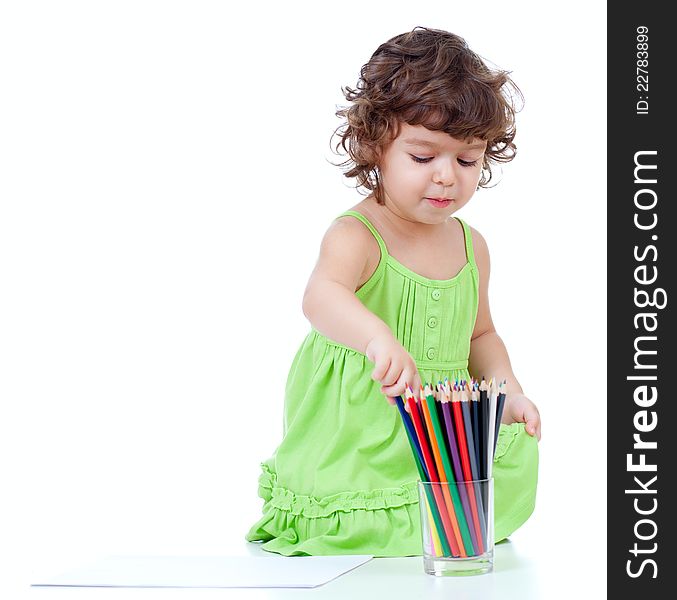 Little girl drawing with pencils on white. Little girl drawing with pencils on white