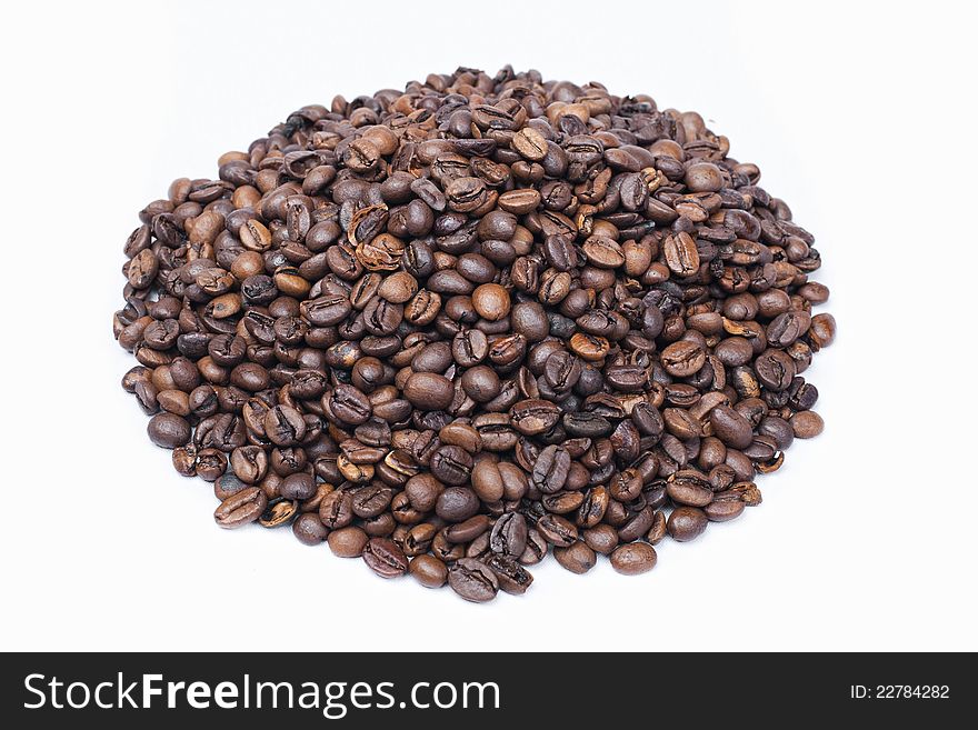 Roasted Coffee beans heap isolated on white background