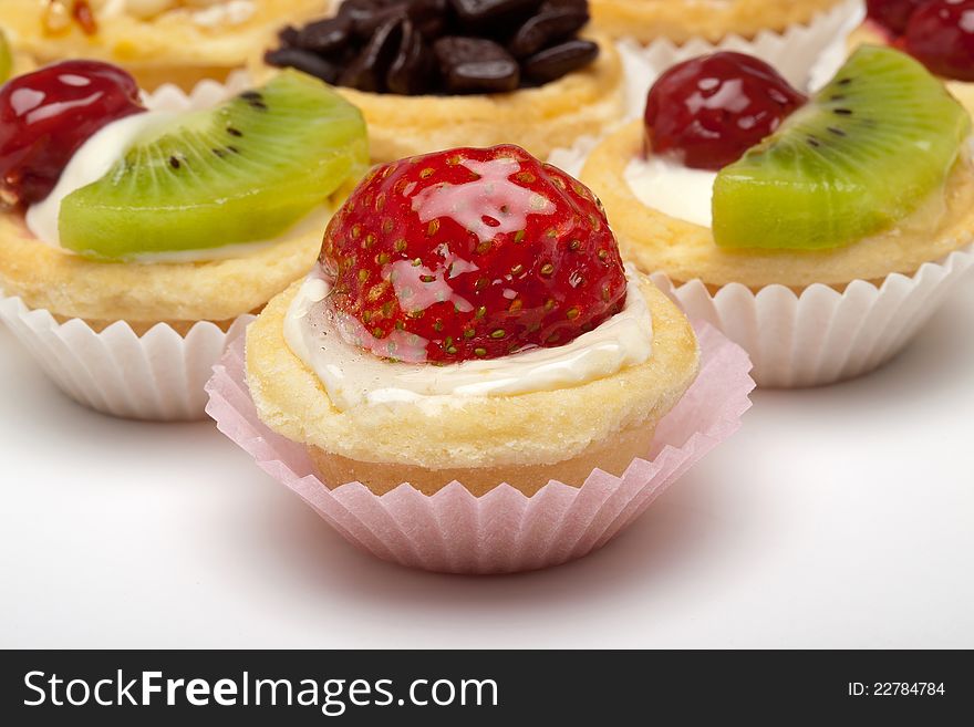 Strawberry, cherry, kiwi, and chocolate cupcake