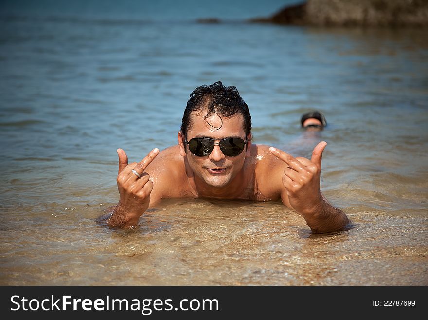 A Handsome and Funny guy showing Gestures related to fun he's having. A Handsome and Funny guy showing Gestures related to fun he's having