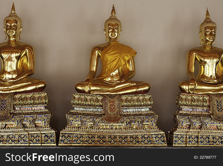 Golden Buddhas At Temple In Thailand.