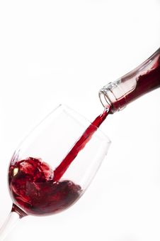 Red Wine Pouring Into Glass Stock Photo