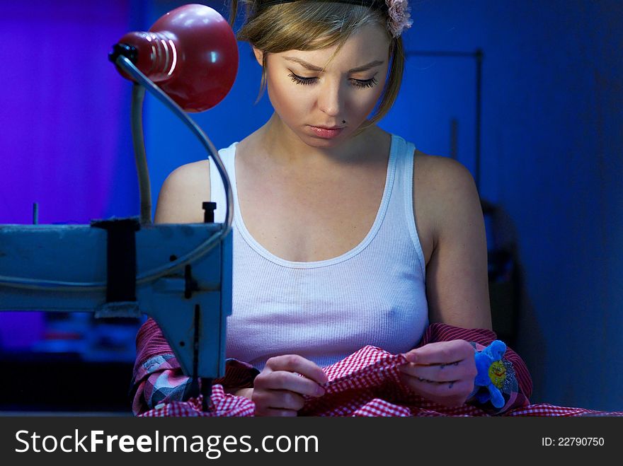 Seductive Blond Sewing In Her Workshop