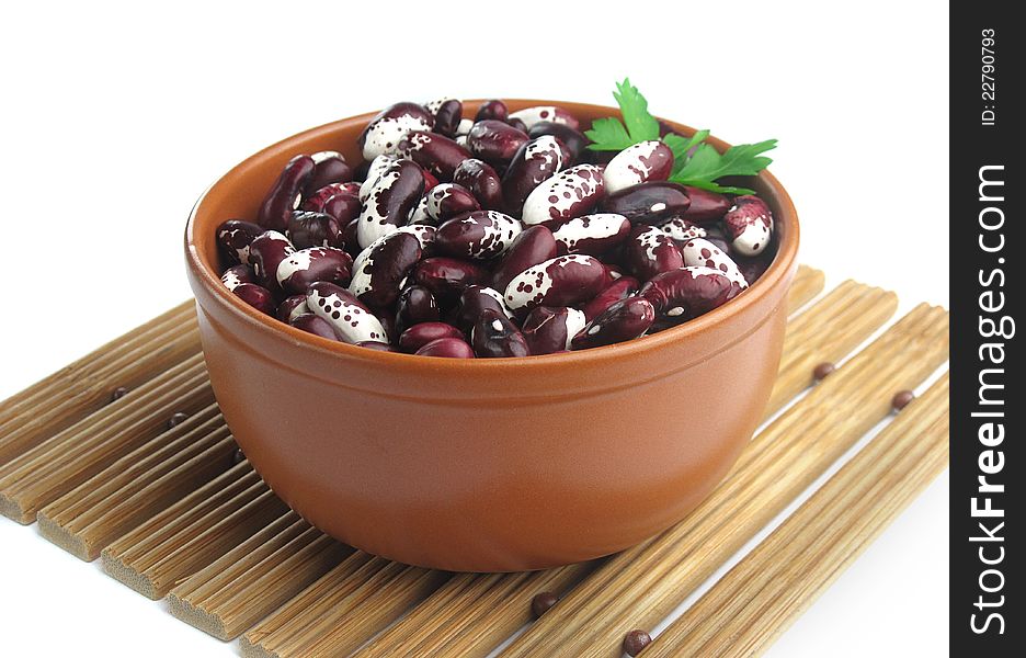 Beans on a plate on a white background