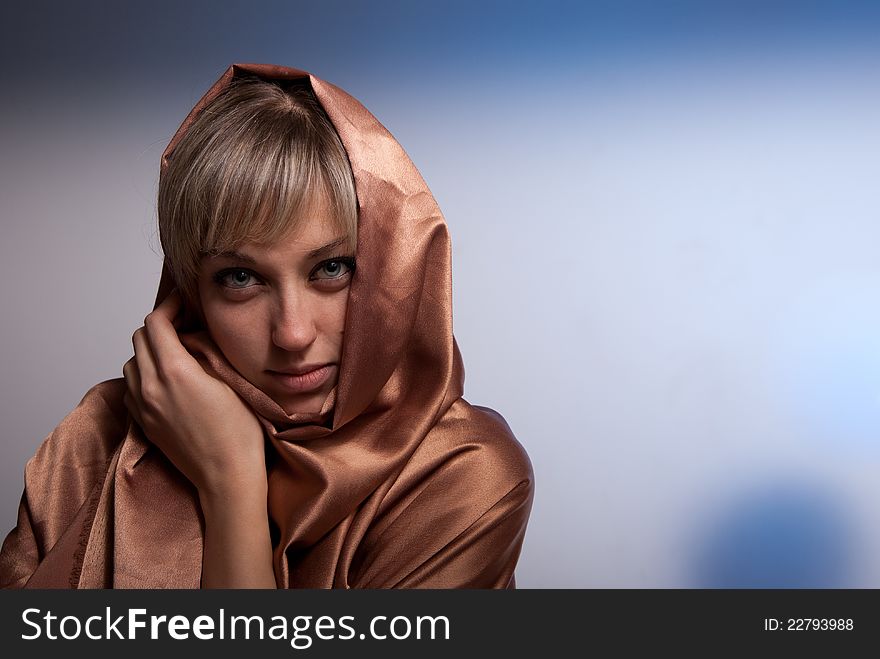 Portrait of girl on a background beige fabric. Blonde. Portrait of girl on a background beige fabric. Blonde.