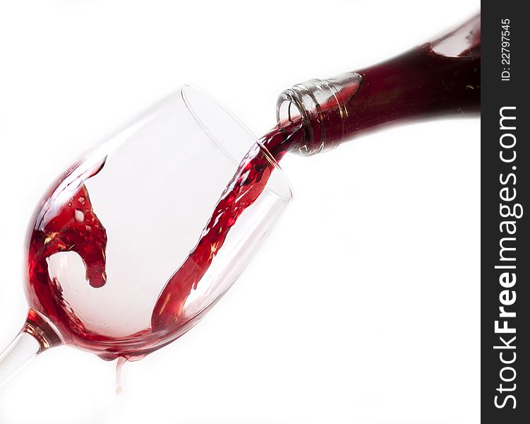 Red wine pouring into glass