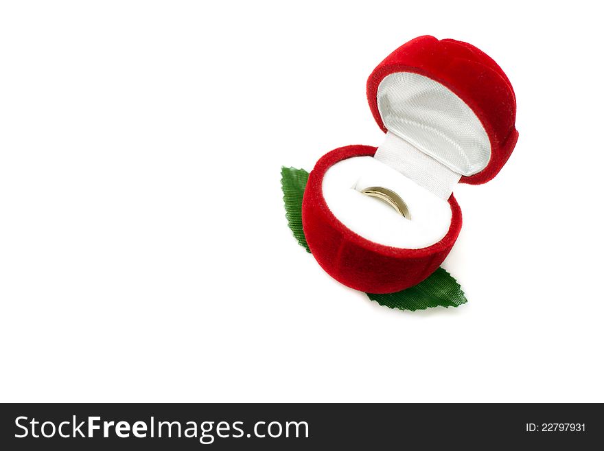 Red box for jeweller ornaments and a gold ring