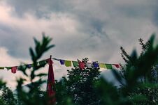 Colored Tibetan Flags. Vegetation On The Foreground. Clouds And Mountains On The Background. Concept Of Tibetan Culture, Buddhism Stock Images Colored Tibetan Flags. Vegetation On The Foreground. Clouds And Mountains On The Background. Concept Of Tibetan Culture, Buddhism Stock Images