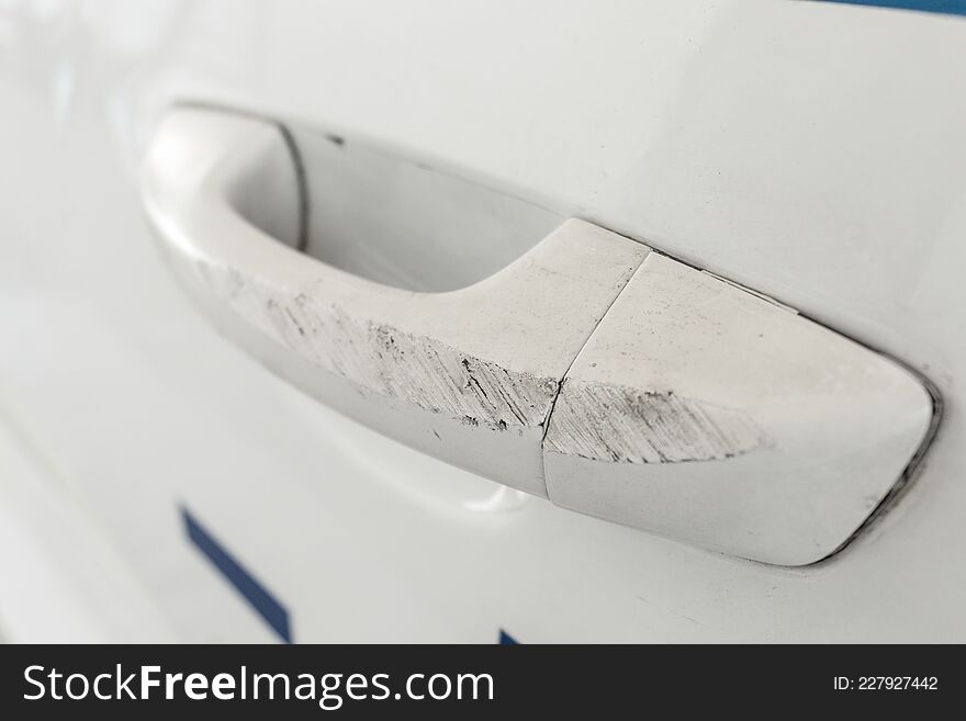 Close-up Of A White Damaged Car Handle. Copy Space.