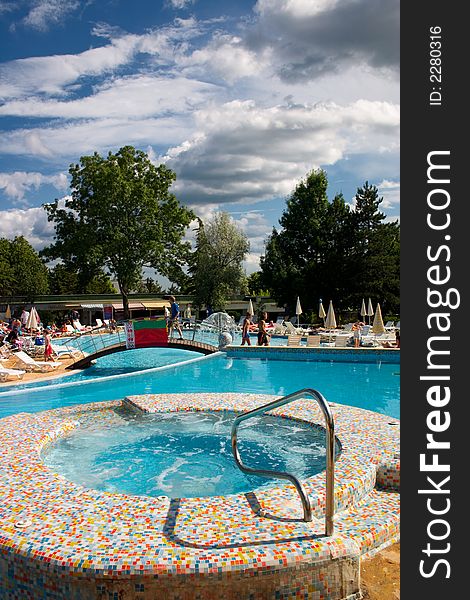 Swimming pool at a resort and sky with clouds. Swimming pool at a resort and sky with clouds