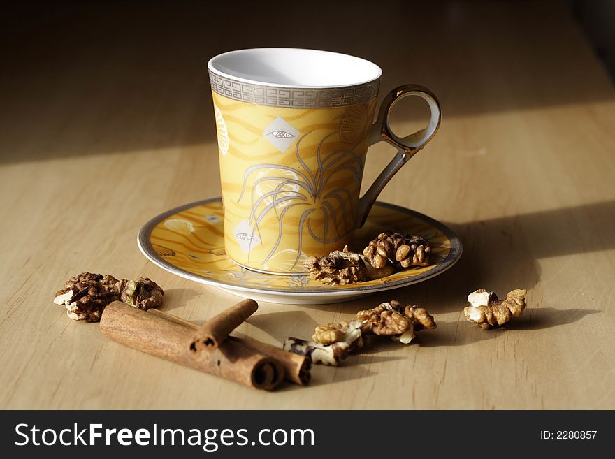 Cup of coffee, walnuts and cinnamon. Cup of coffee, walnuts and cinnamon