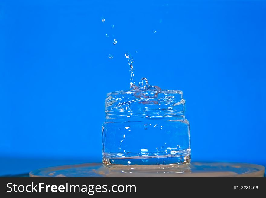 Water jug with splashes water. Water jug with splashes water