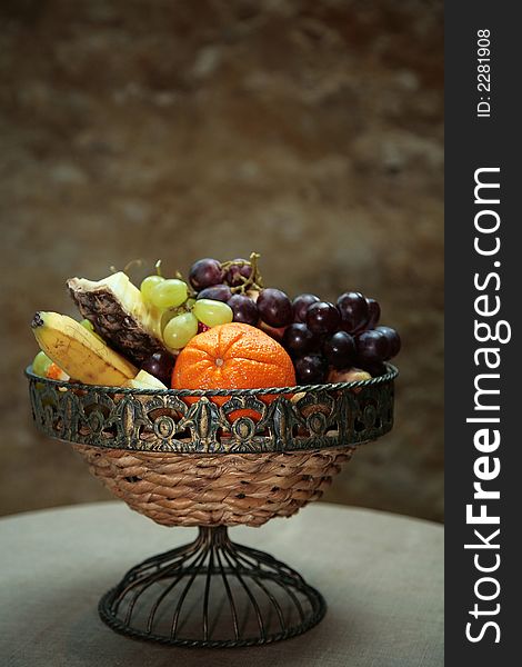 Fruits in a basket on table. Fruits in a basket on table