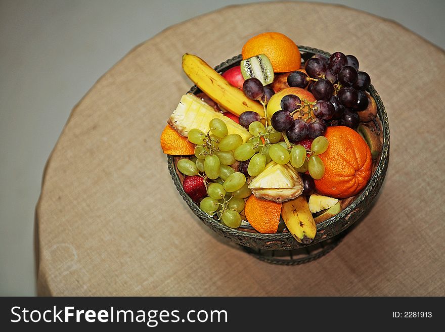 Fruits in a basket on table. Fruits in a basket on table