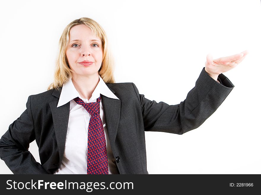 A business woman in a suit gesturing with her left hand. A business woman in a suit gesturing with her left hand