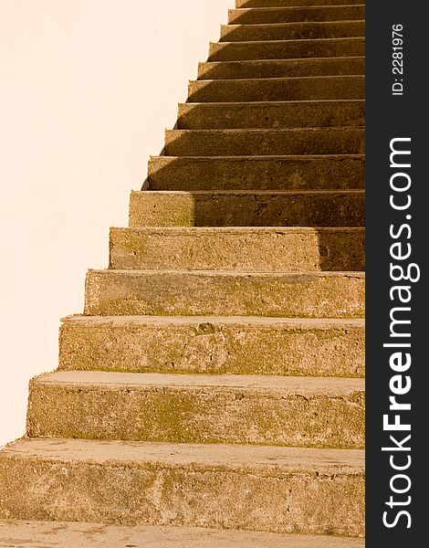 A sand stone staircase in shadow