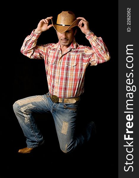 Adult cow boy looking great and posing for fashion shots. Adult cow boy looking great and posing for fashion shots