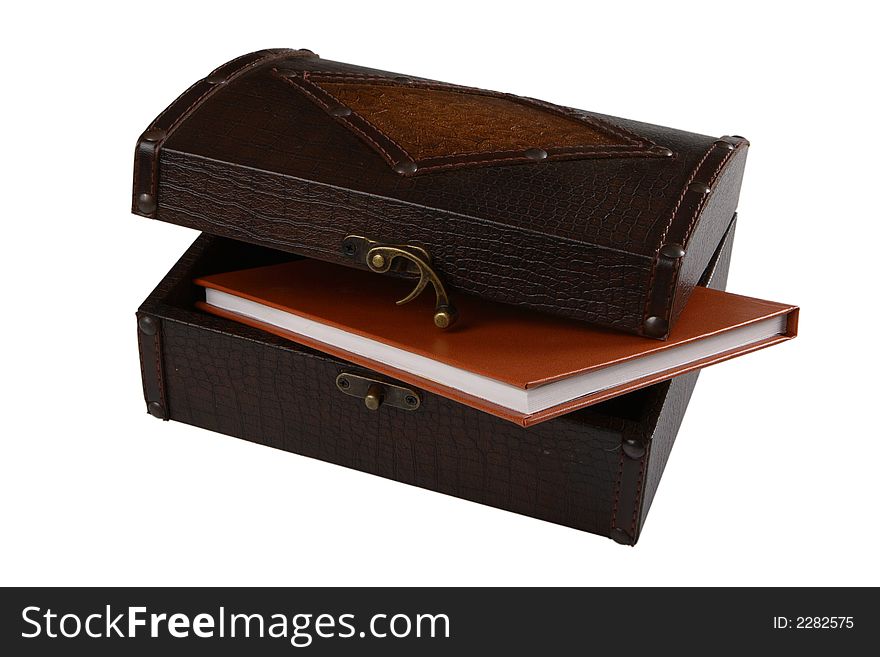 Wooden chest and diary on white background