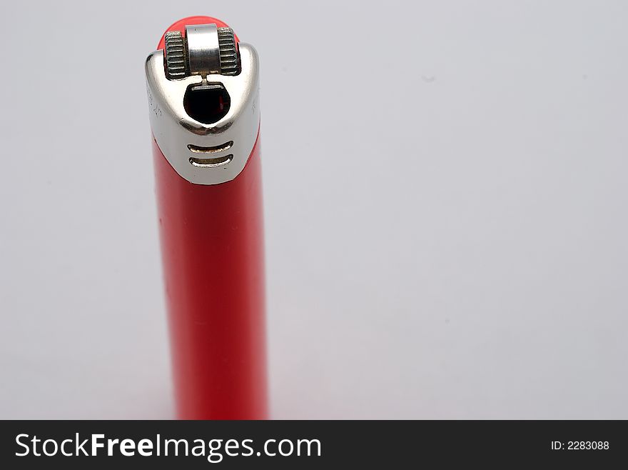 A close up of a red lighter