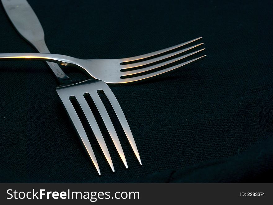 A macro of two fork crossed Together. A macro of two fork crossed Together