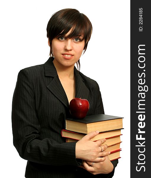 The young girl with books and a red apple, isolated on white