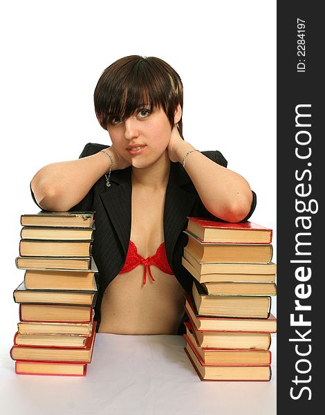 The young smiling girl with books, isolated on white. The young smiling girl with books, isolated on white