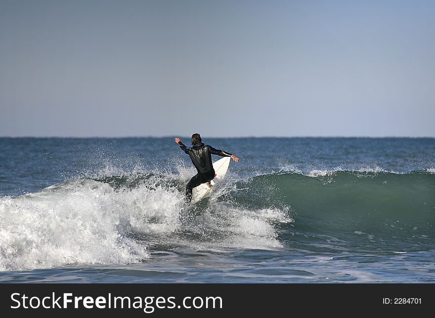 Surfer on top of the wave