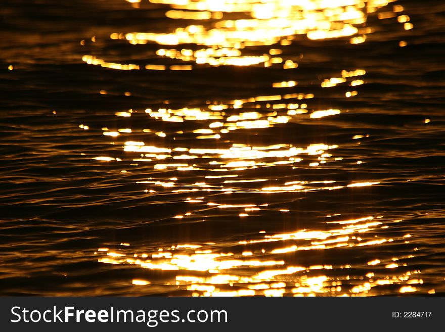 Bright reflection of the sunset on the water
