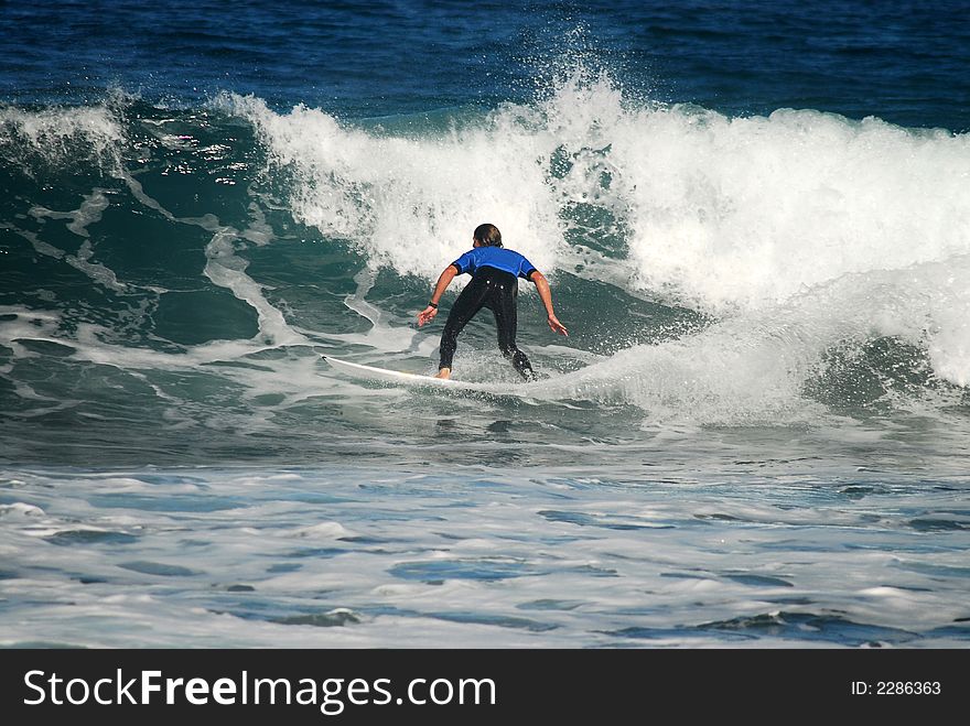 Surfboard rider on a wave. Surfboard rider on a wave