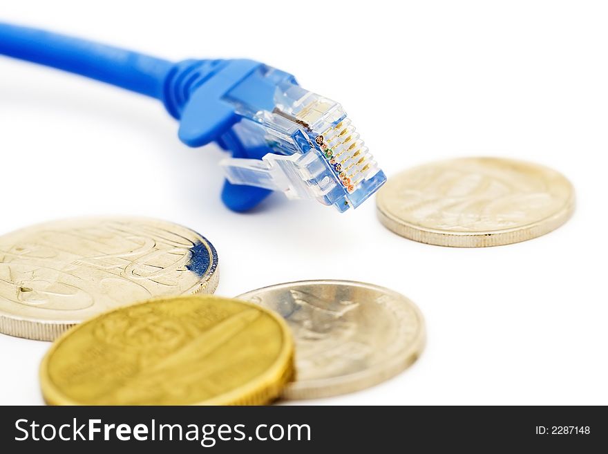 A close-up shot of a lan cable and coins. A close-up shot of a lan cable and coins