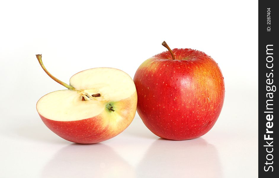 Close up of two red apples on a white background
