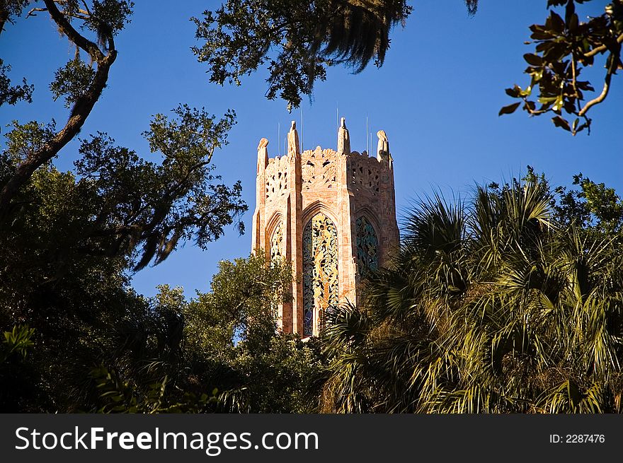A view of the top third of the beautiful Bok Tower, housing carillon bells that ring every hour for tourist at the popular botanical gardens in Lake Wales, Florida. A view of the top third of the beautiful Bok Tower, housing carillon bells that ring every hour for tourist at the popular botanical gardens in Lake Wales, Florida.
