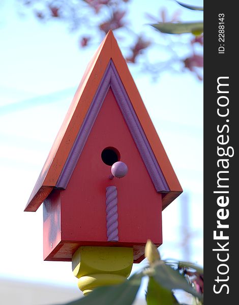 Colorful fun outdoor bird house. Colorful fun outdoor bird house