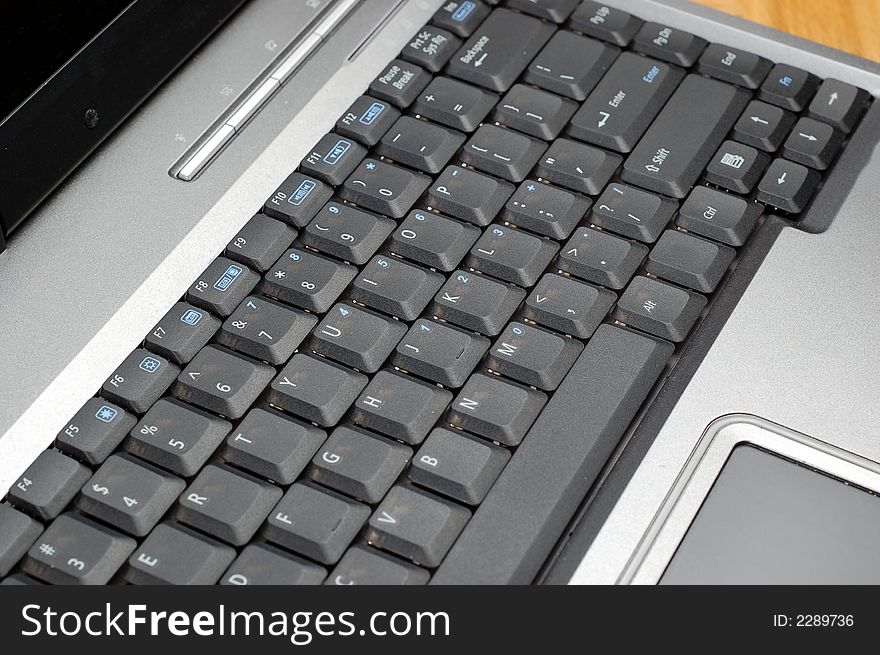 Silver laptop with black keyboard. Silver laptop with black keyboard