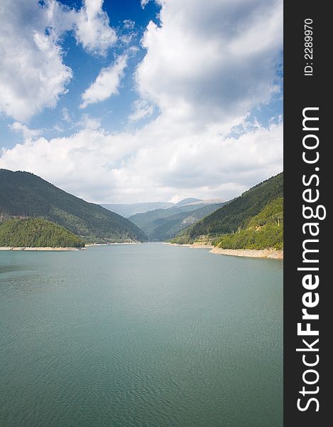 Lake and mountains in a summer day. Lake and mountains in a summer day