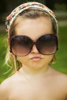 The Little Girl Wears A Large Adult Sunglasses Stock Photos The Little Girl Wears A Large Adult Sunglasses Stock Photos