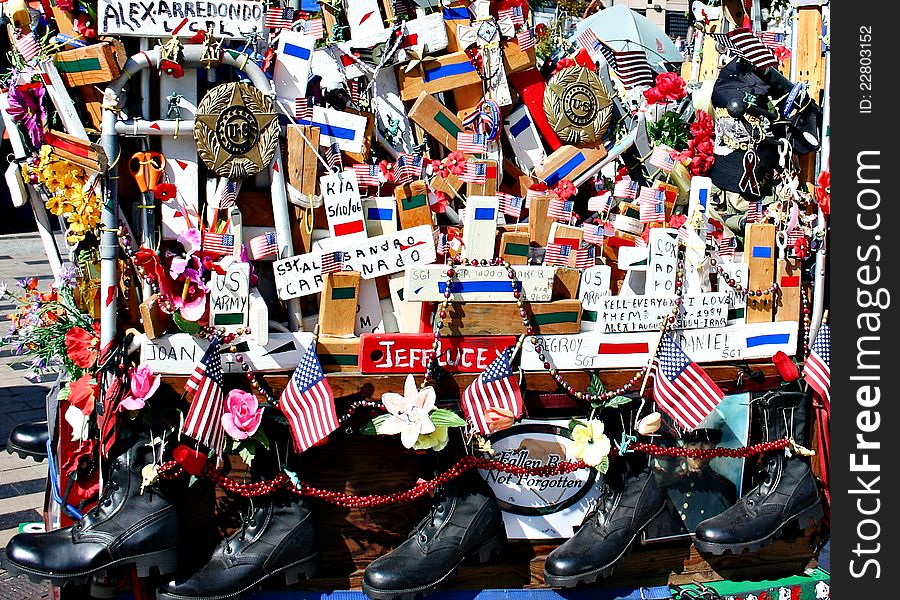 A stall sells the items of patriotic nature, like flags and soldiers' shoes. A stall sells the items of patriotic nature, like flags and soldiers' shoes.