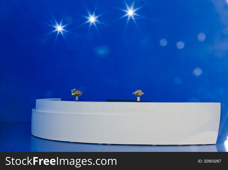 Reception desk with blue background