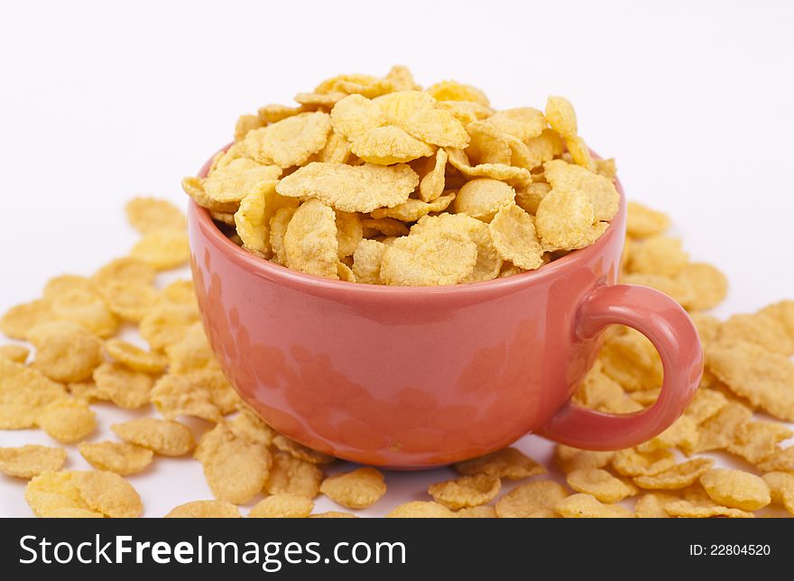 Bowl of flakes on white