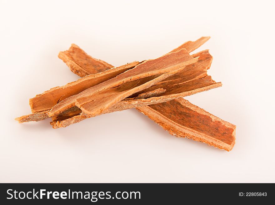 Dark stick of cinnamon or dalchini in a background