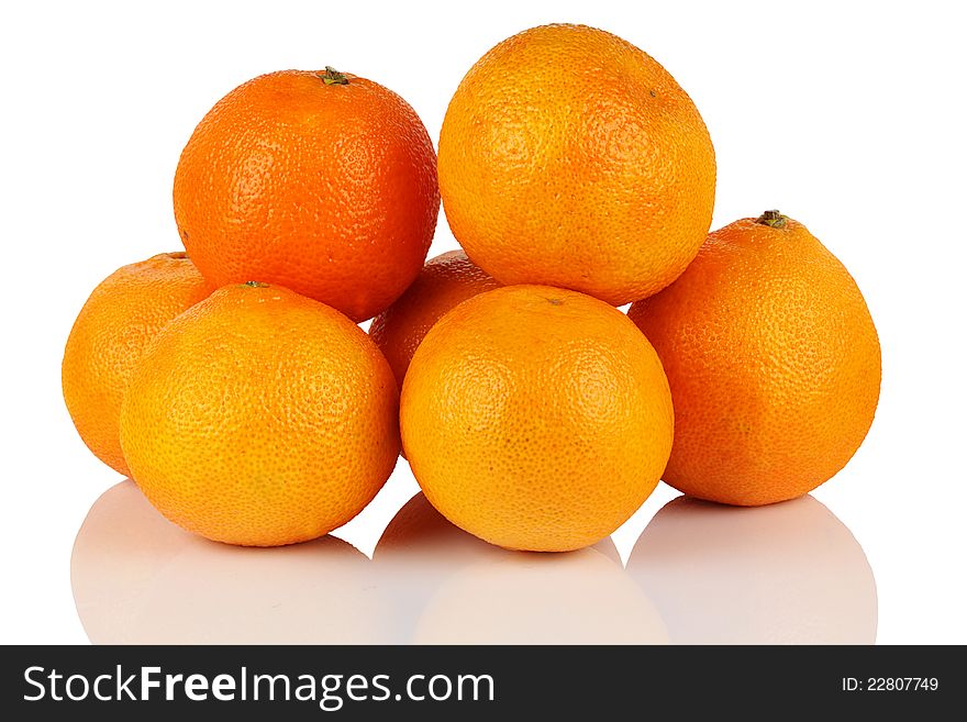 Seven fresh ripe mandarin oranges on a white background. Seven fresh ripe mandarin oranges on a white background.