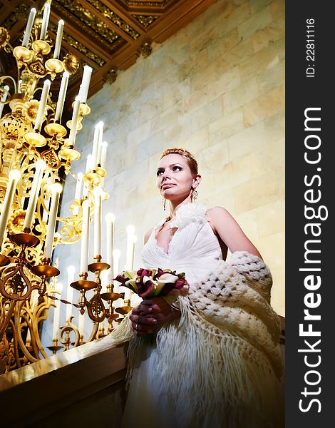 Elegant bride in interior of hotel