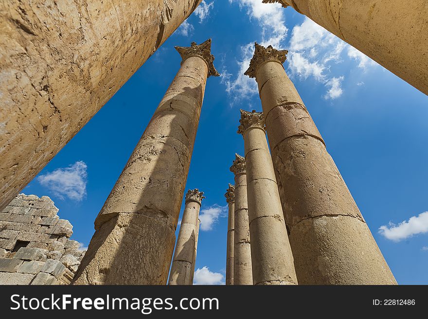 Columns reaching for the sky in the temple of Artemis at Jerash, Jordan. These mammoth pillars, built almost two millennia ago were designed to sway gently, absorbing the effects of earth tremors and high winds. Columns reaching for the sky in the temple of Artemis at Jerash, Jordan. These mammoth pillars, built almost two millennia ago were designed to sway gently, absorbing the effects of earth tremors and high winds.