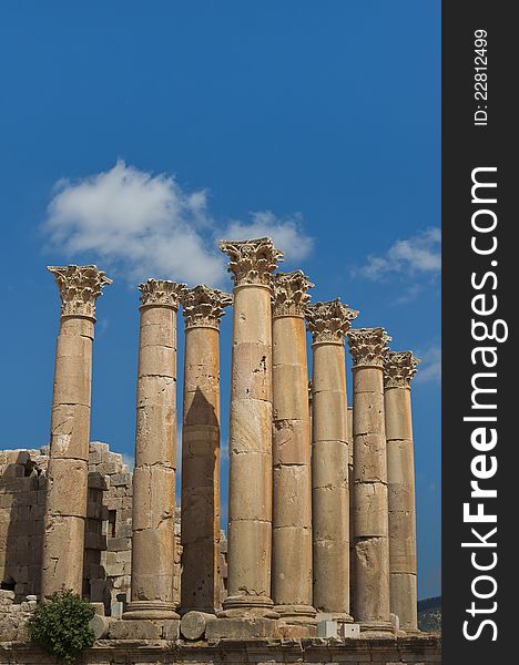 Eight columns with capstones in the Temple of Artemis, on a blue sky. These mammoth pillars, built almost two millennia ago were designed to sway gently, absorbing the effects of earth tremors and high winds. Eight columns with capstones in the Temple of Artemis, on a blue sky. These mammoth pillars, built almost two millennia ago were designed to sway gently, absorbing the effects of earth tremors and high winds.