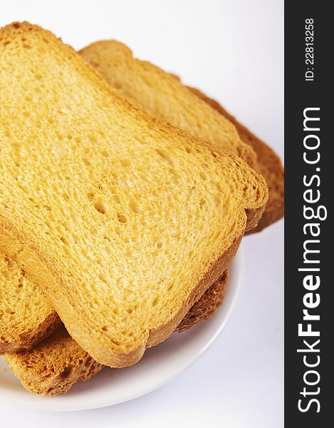 Toasted bread slices for breakfast isolated on white studio background.