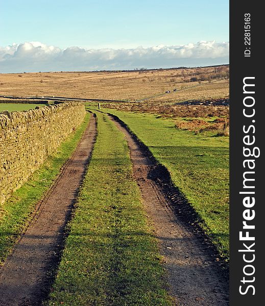 Two farmers tracks leading round a left hand bend across the English countryside. Two farmers tracks leading round a left hand bend across the English countryside