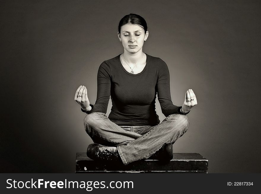 Beautiful girl practicing yoga, isolated on black