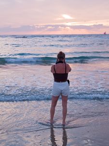 Woman On A Beach Taking Pictures With Camera Stock Image Woman On A Beach Taking Pictures With Camera Stock Image