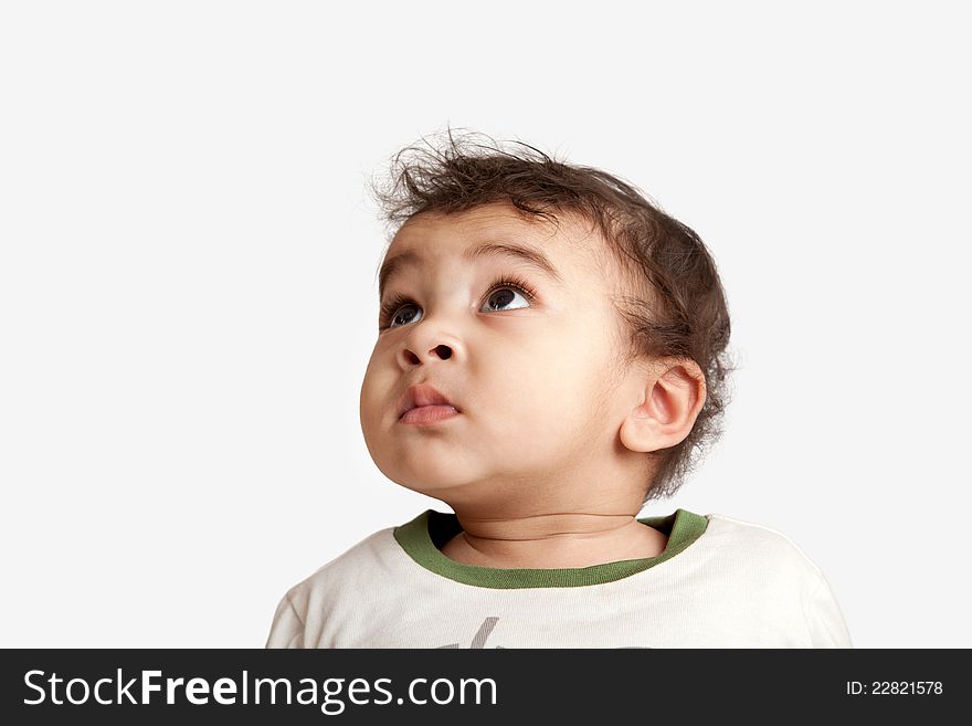 Curious indian kid looking at the camera on white background. Curious indian kid looking at the camera on white background.