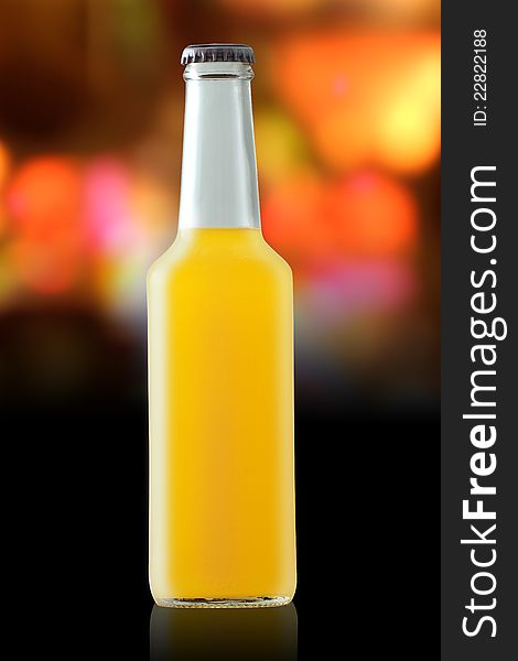Orange cocktail on the background of a variety of colors